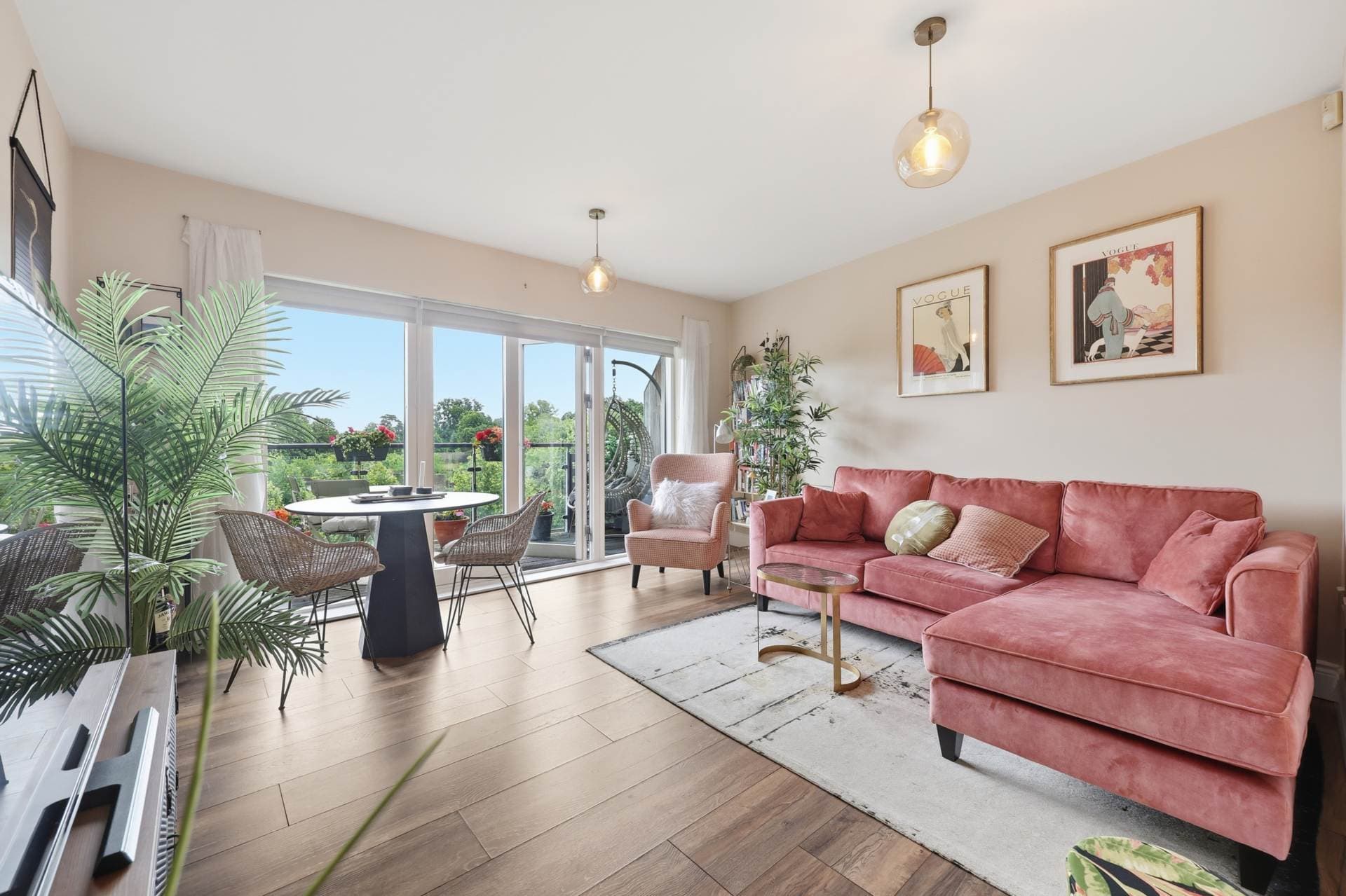 Open-plan living and dining area with balcony access and views over Santry Demesne