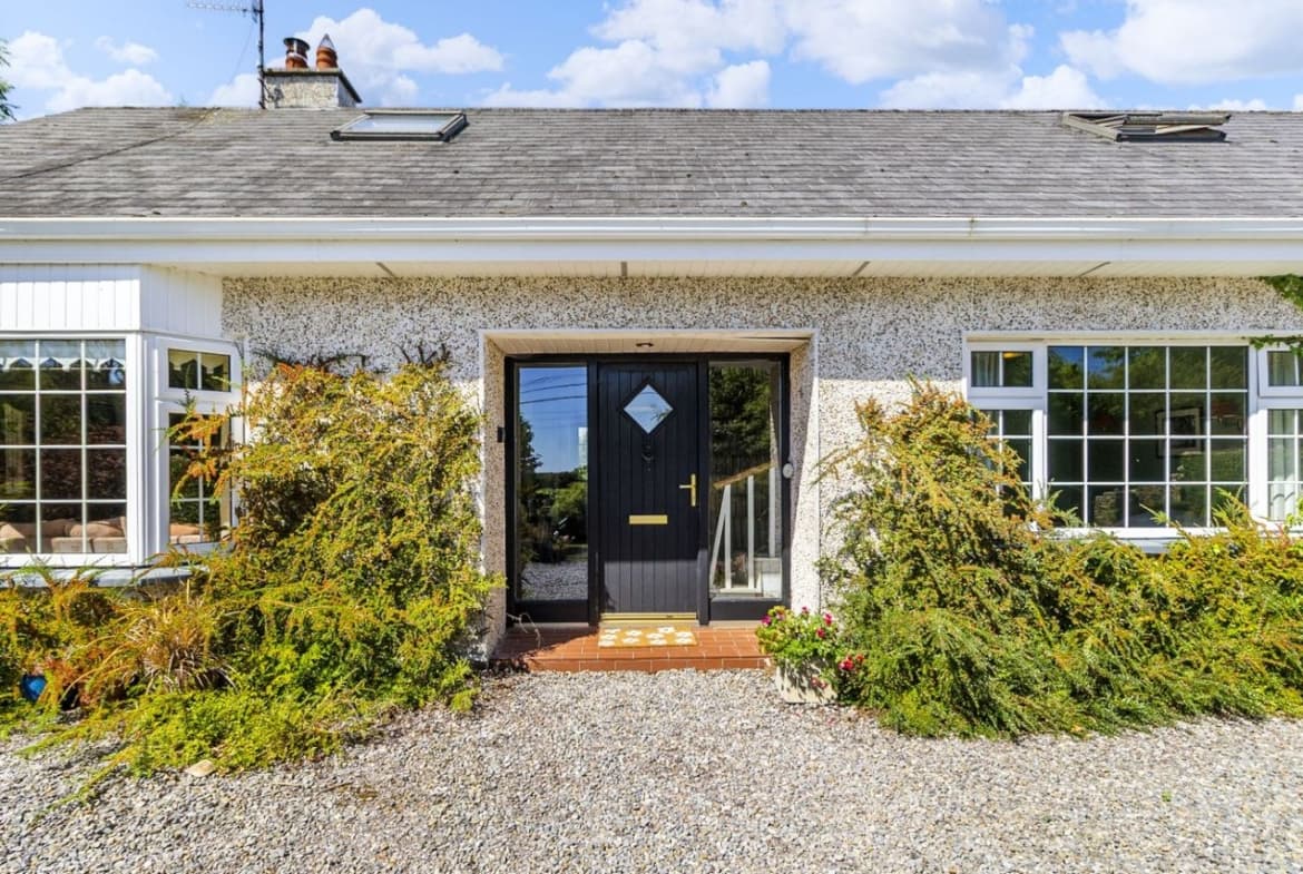 Front entrance of Young Grove with gravel driveway