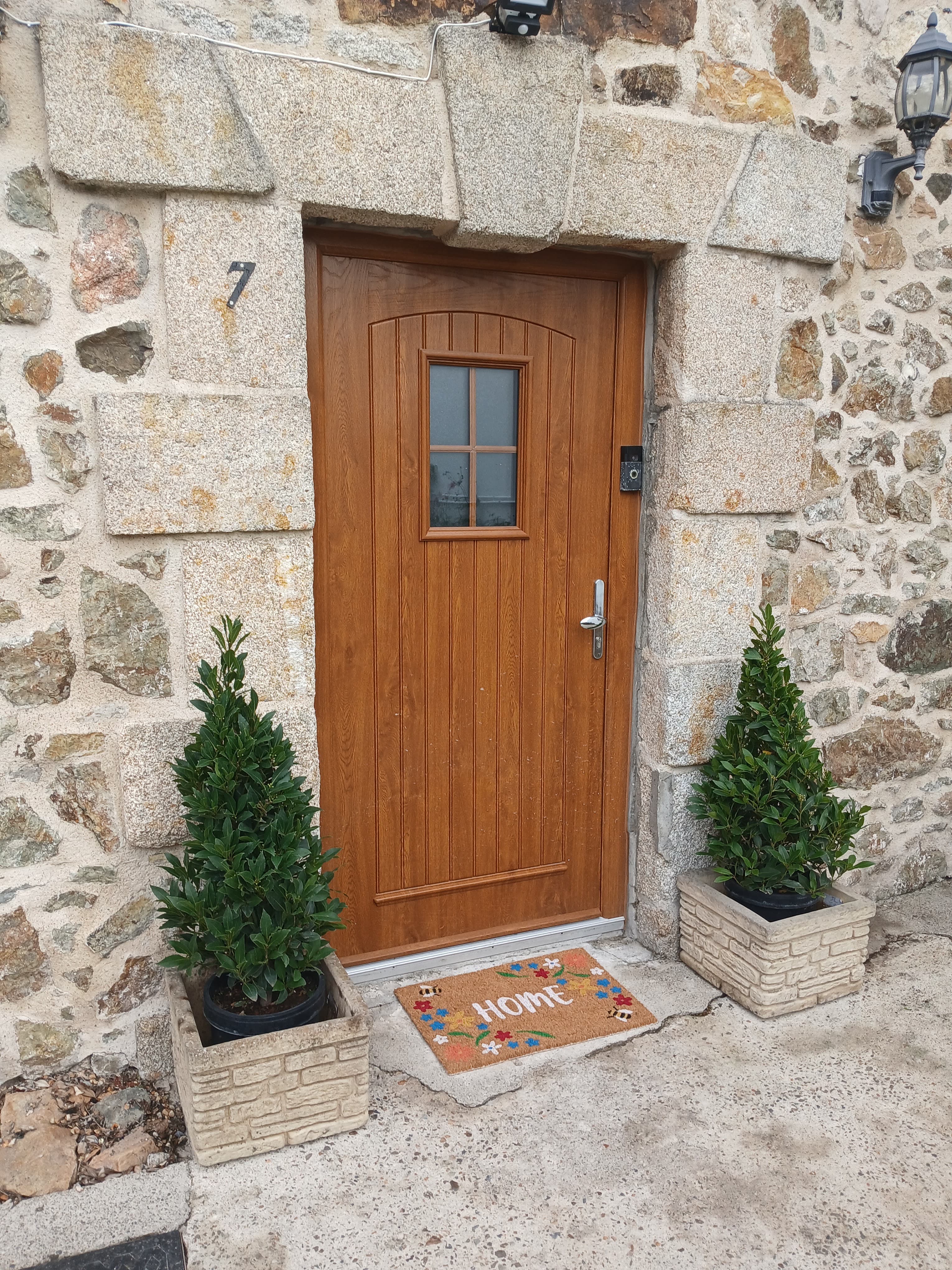 Front door of Garrison House framed by granite stonework