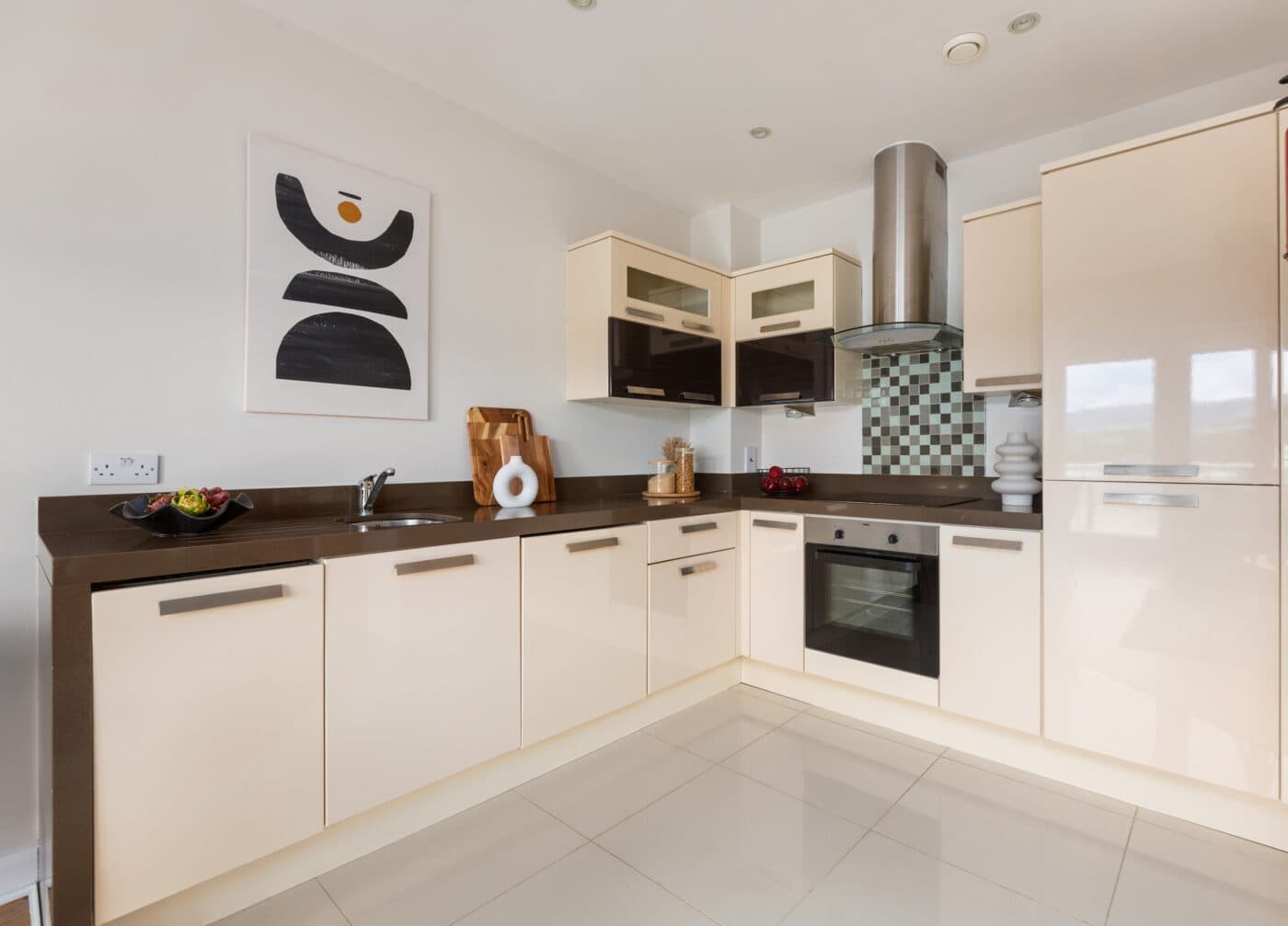 Contemporary kitchen with integrated appliances and gloss cabinetry